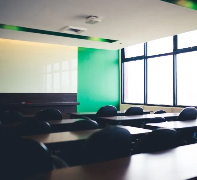 room with wood table and black chair