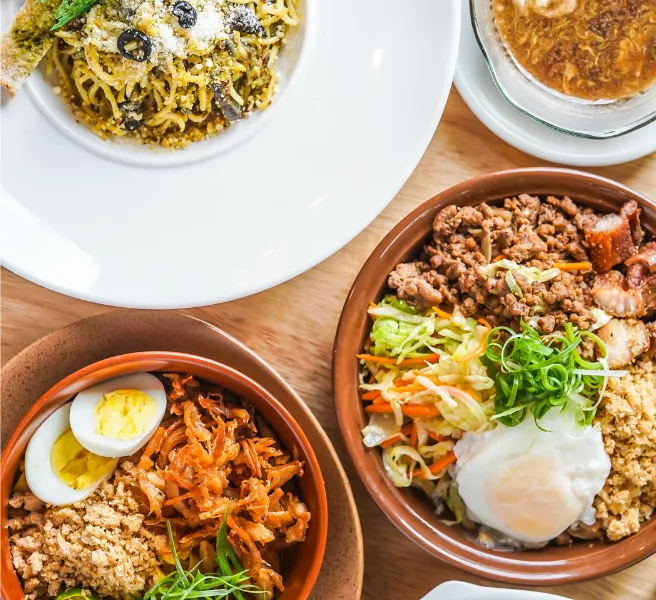 four bowls filled with vegetables, egg and meet
